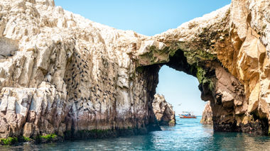 Scneic shot of a rock archway in the Ballestas Islands, Peru